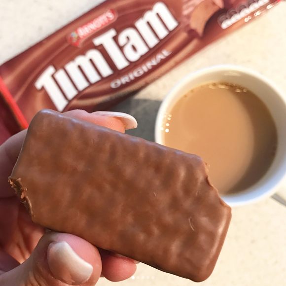 Step one: Bite off opposite corners of the biscuit.